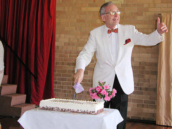 Len Rawle cutting the cake at the 2008 Anniversary concert